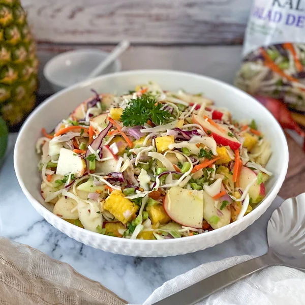 Kale Slaw with fruit and creamy dressing