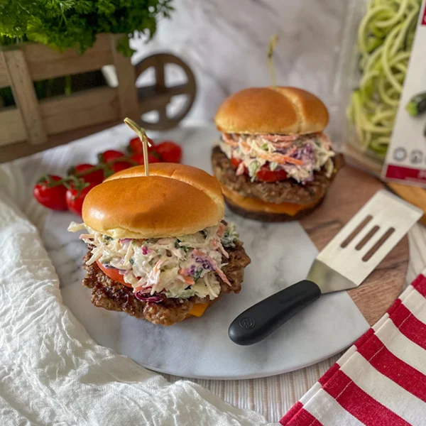 Hamburger made with Zucchini and topped with creamy Kale Slaw in a bun