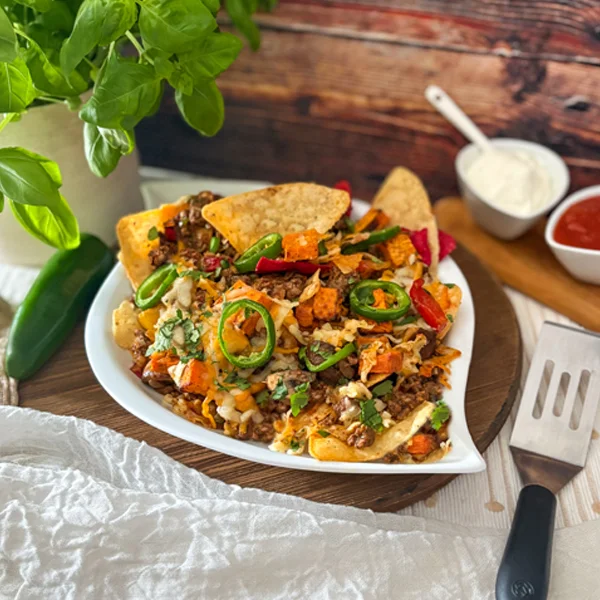 Cheesy Nachos with a sweet potato meat filling topped with cheese