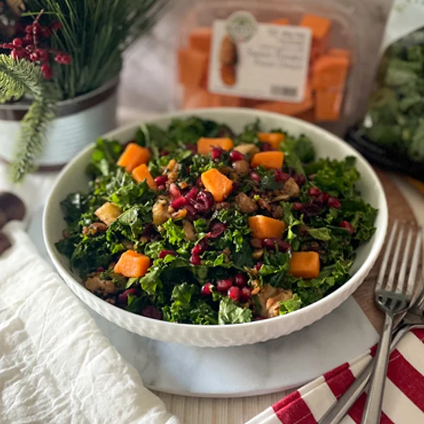 Chopped Kale Salad with mixed nuts sweet potato quinoa and cranberries